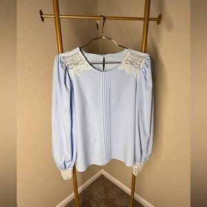 Elegant Light Blue Blouse with Lace Details